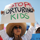 Yvonne Nieves of El Paso, Texas demonstrates in front of the U.S. Border Patrol facility where lawyers reported that detained migrant children were held unbathed and hungry on June 27, 2019 in Clint, Texas.